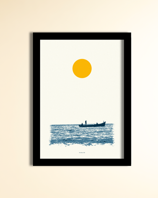 A minimalist framed art print featuring a yellow sun over blue water with a small boat, displayed on a light beige wall.