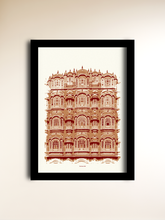 A framed art print of the Hawa Mahal palace in Jaipur, Rajasthan, India, featuring a detailed architectural illustration in terracotta red on an off-white background, enclosed in a black frame and mounted on a light beige wall.